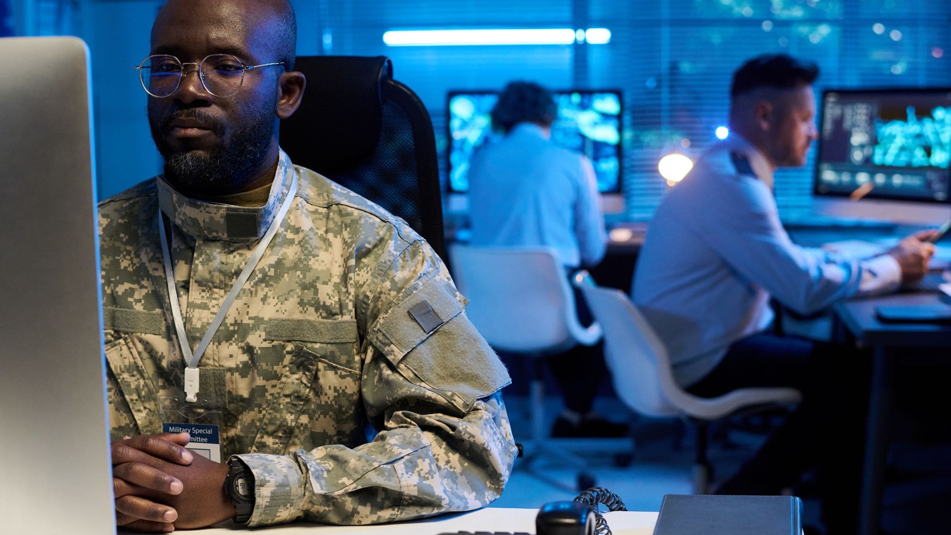 Military cybersecurity operations center monitoring defense network security architecture and tactical communications